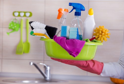 Professional house cleaners tidying a living room in Hillingdon