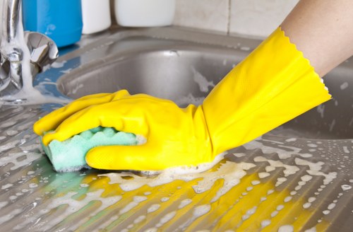 Professional house cleaners working in a modern Stroud Green home